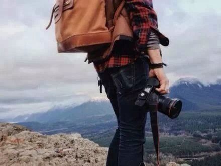 lifestyles, leisure activity, standing, sky, casual clothing, men, mountain, photography themes, photographing, cloud - sky, rear view, three quarter length, landscape, nature, focus on foreground, camera - photographic equipment, person, field