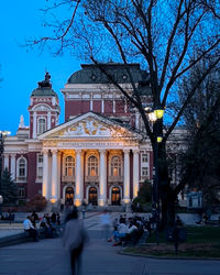 People in front of building