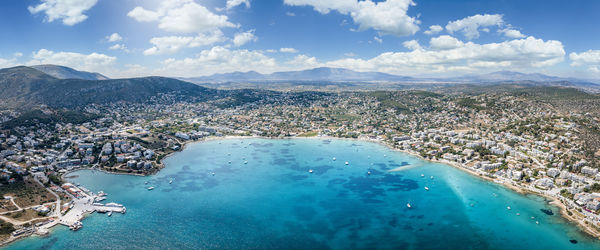 Aerial view of sea and mountains against sky