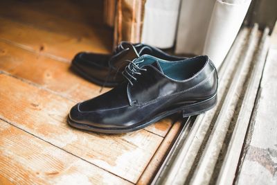 High angle view of shoes on hardwood floor