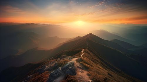 Scenic view of mountains against sky during sunset