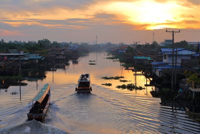 Scenic view of river against sky during sunset
