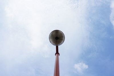 Low angle view of communications tower against sky