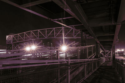 Illuminated footbridge at railroad station