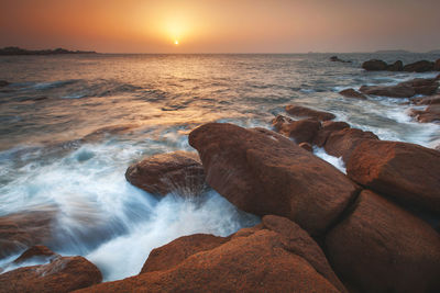 Scenic view of sea against sky during sunset