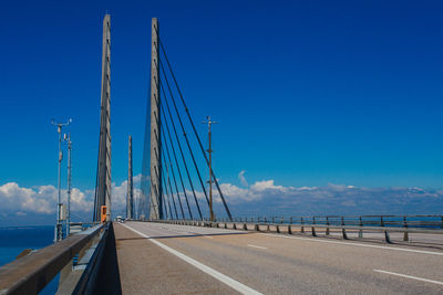 View of bridge over sea against blue sky