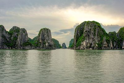 Panoramic view of sea and mountains against sky