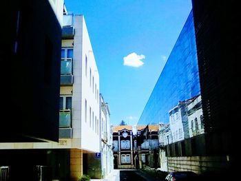 Panoramic view of city against blue sky