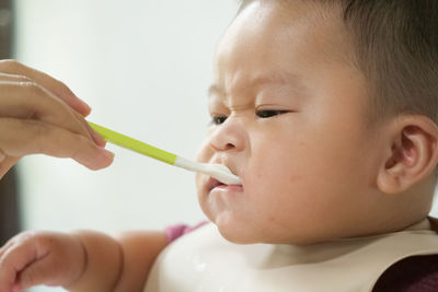 Close-up portrait of cute boy holding ice cream