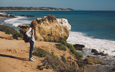Woman standing at beach