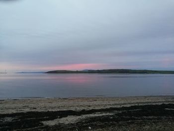 Scenic view of sea against sky at sunset