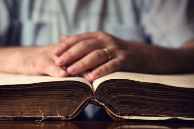 Close-up of hand holding book