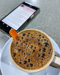 High angle view of coffee cup on table