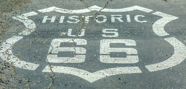 High angle view of road sign on street