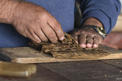 Close-up of man working on wood