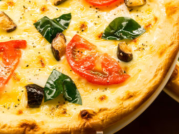 Close-up of pizza served in plate