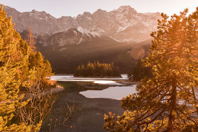 Scenic view of lake and mountains against sky