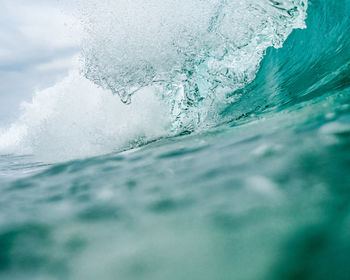 Close-up of water splashing in sea