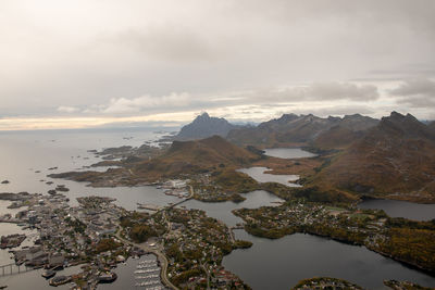 Scenic view of sea and mountains against sky