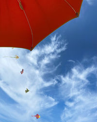 Low angle view of colorful umbrella against sky