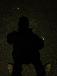 Shadow of people in dark room