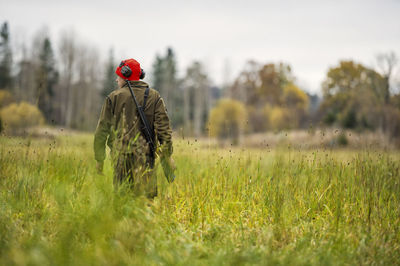 Teenage boy with rifle at hunting