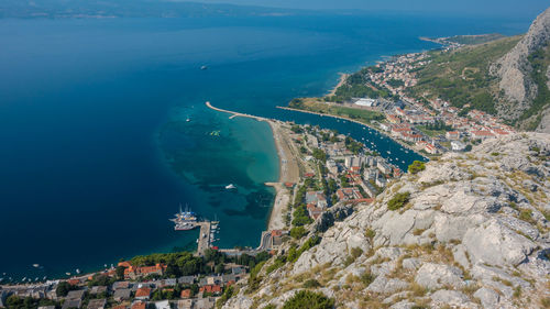 High angle view of townscape by sea