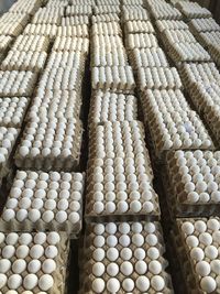 High angle view of eggs in crate at poultry farm