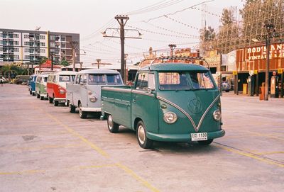 Cars on street against buildings in city