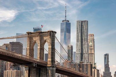 Low angle view of buildings against cloudy sky