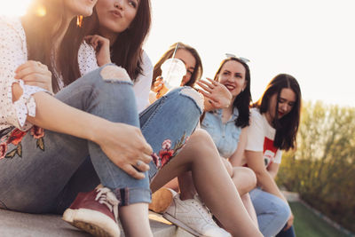 Happy friends enjoying in city during sunset