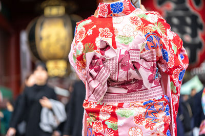 Midsection of woman in traditional clothing on road