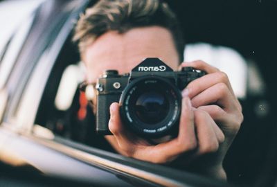 Close-up of hand holding camera