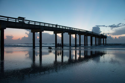 Bridge over river against sky