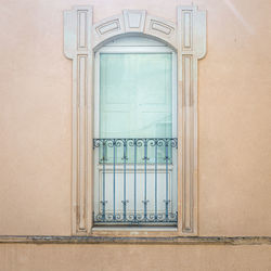 Windows in the facades of ancient baroque houses