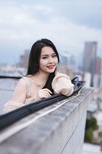 Portrait of young woman sitting on boat