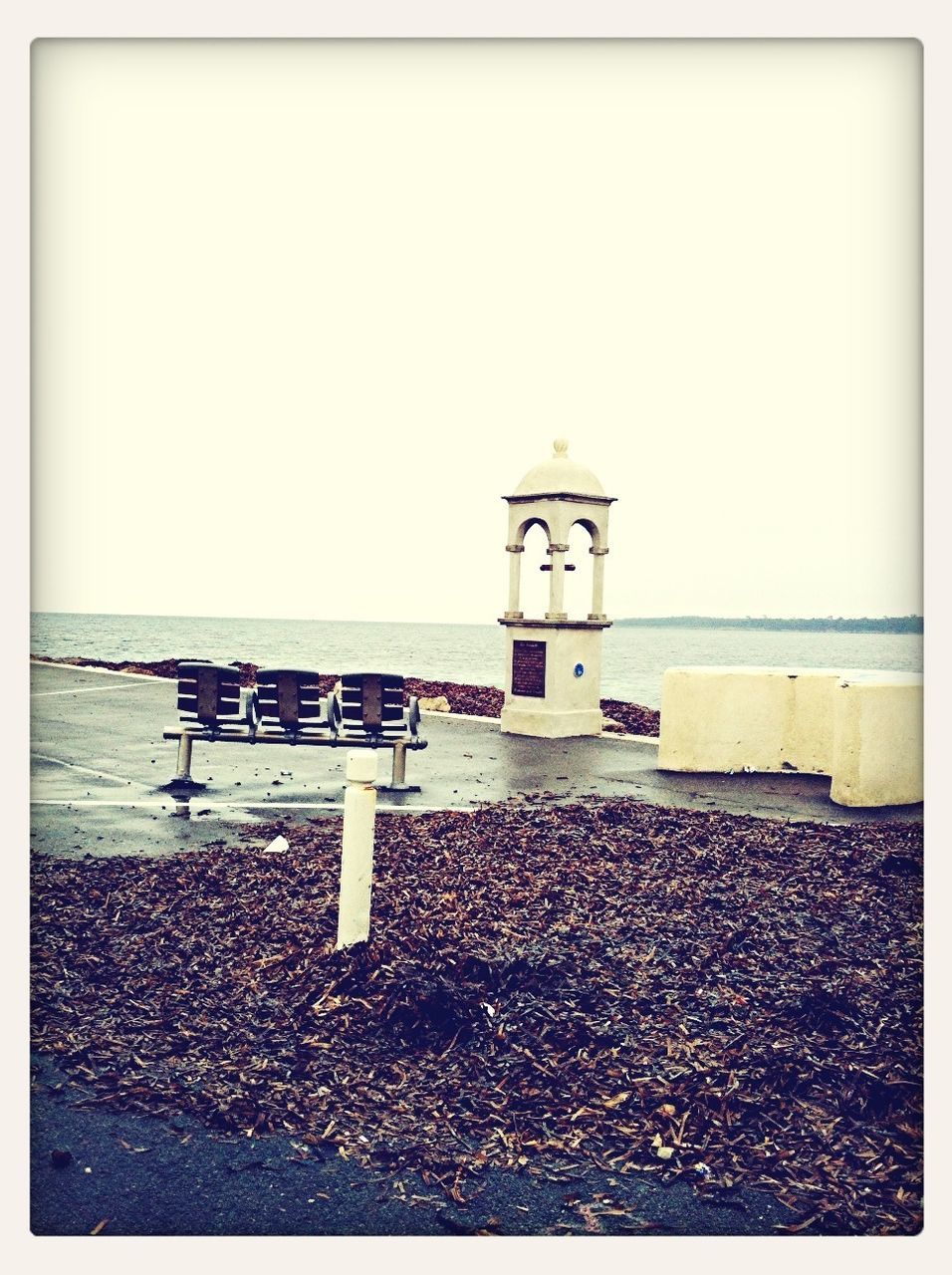 transfer print, auto post production filter, text, built structure, western script, communication, guidance, architecture, clear sky, beach, copy space, day, direction, building exterior, sand, outdoors, sky, no people, sign, sea