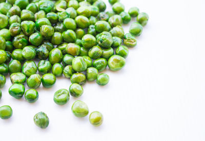 High angle view of green beans against white background