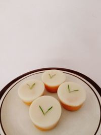 High angle view of fruits in plate on table
