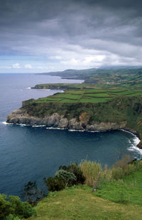 Scenic view of sea against cloudy sky