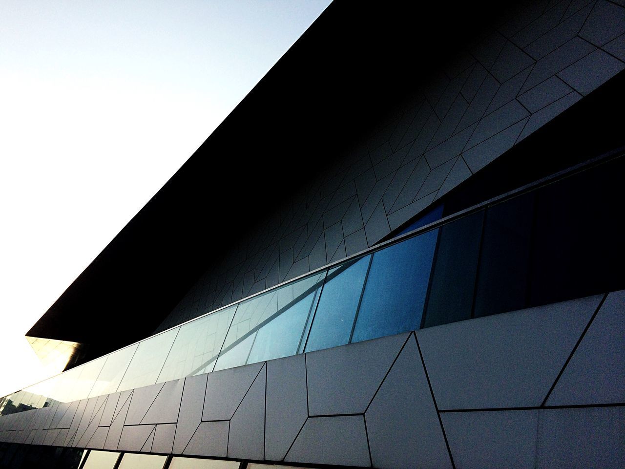 building exterior, built structure, architecture, modern, low angle view, building, city, sky, no people, office building exterior, office, nature, glass - material, clear sky, day, pattern, reflection, geometric shape, sunlight, outdoors, skyscraper