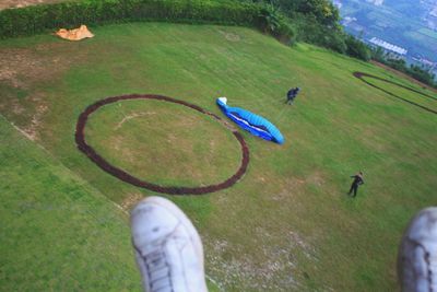 High angle view of people on grassy field