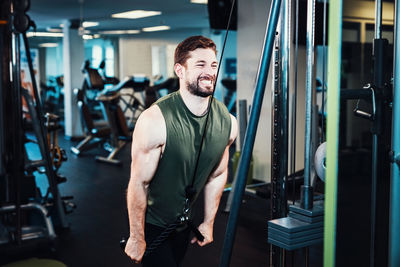 Young man exercising in gym