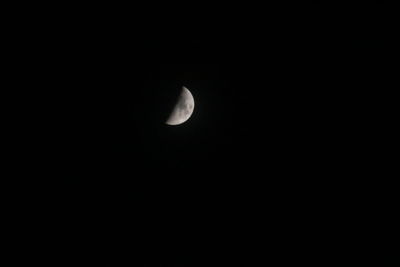 Low angle view of moon against sky at night