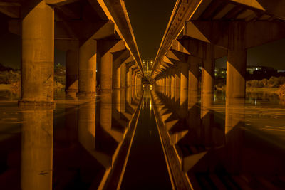 Illuminated bridge at night