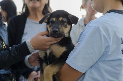 Close-up of people with dog