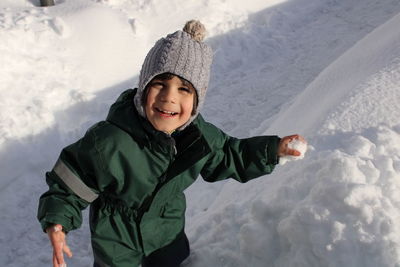 Portrait of boy playing in winter