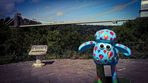 Colorful bench on footpath