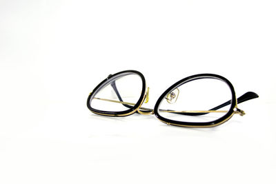 Close-up of eyeglasses against white background