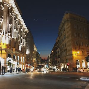 Cars on road in city at night